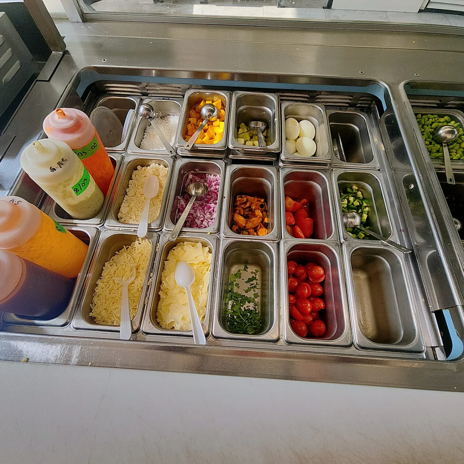Freshii Sundance ingredient line with cheeses, eggs, tomatoes and sauces