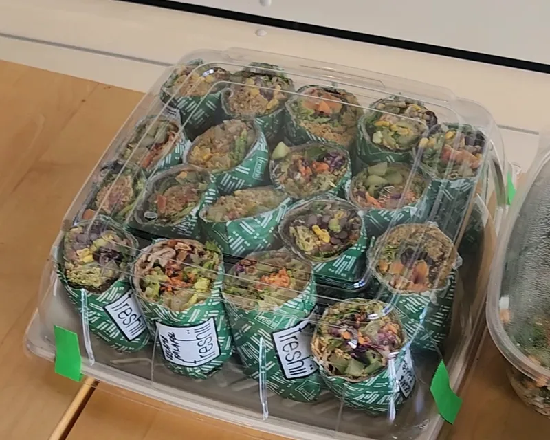 Freshii Sundance catering wrap platter: wraps cut in half and labelled in a lidded tray