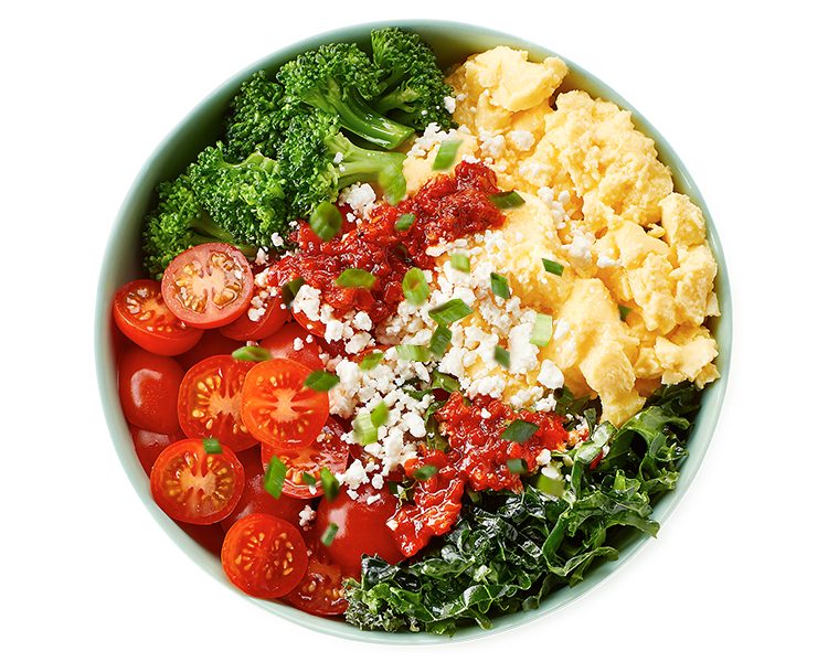 Green Eggs & Kale Breakfast Bowl with cage-free eggs, kale, mushrooms, avocado, and pesto at Freshii Sundance