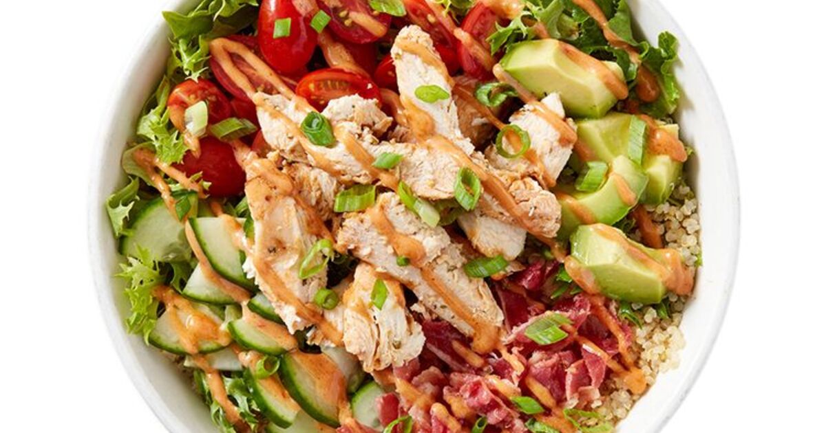 Freshii bowl with chicken, greens, tomato, cucumber, avocado and grains